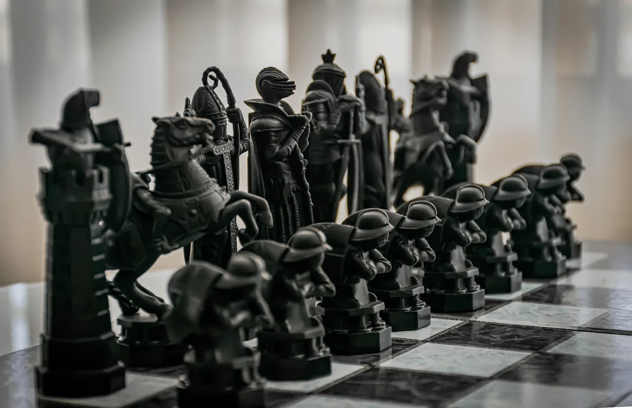 Wizard-themed black chess pieces on a chessboard